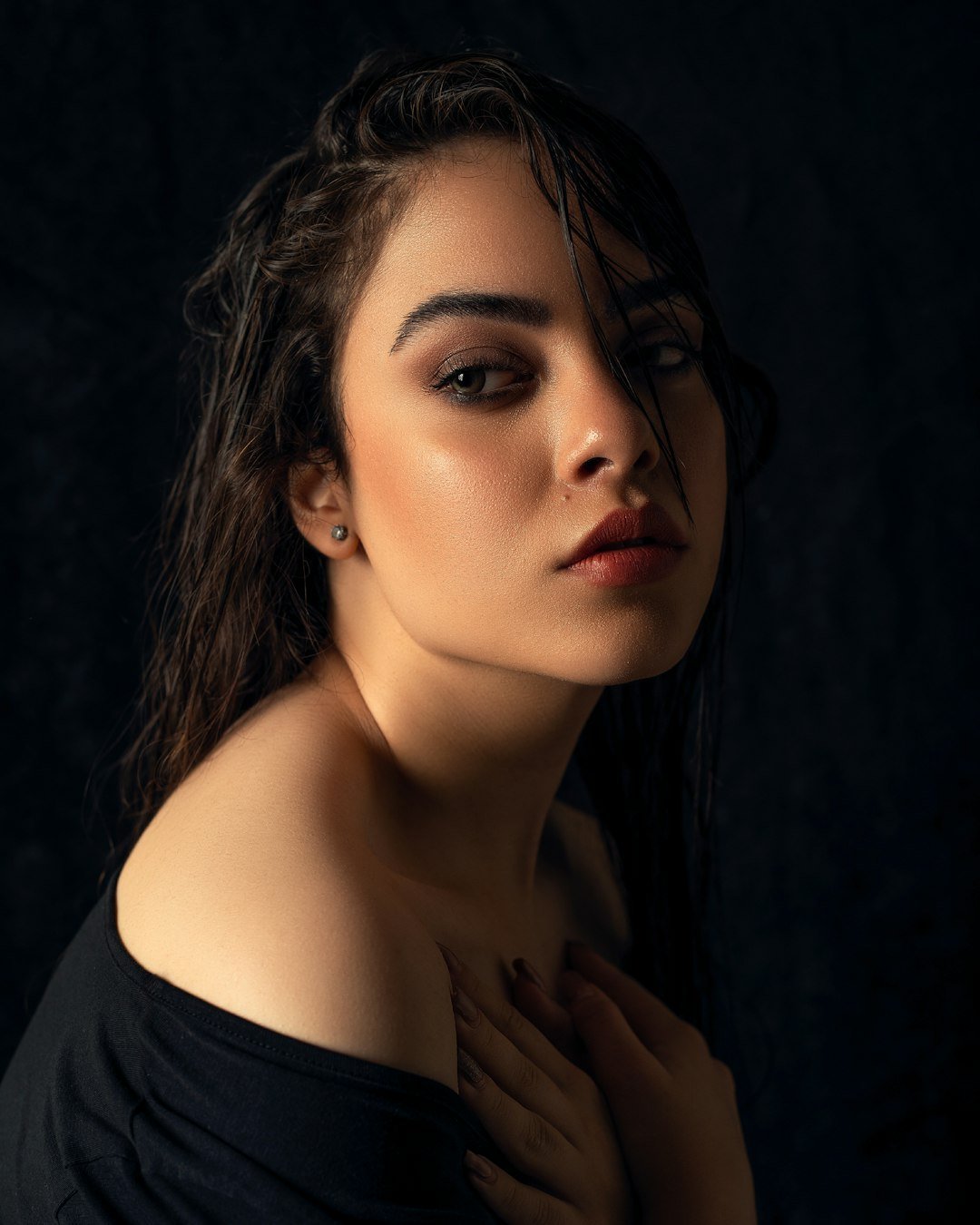 Studio portrait of a woman in a black top